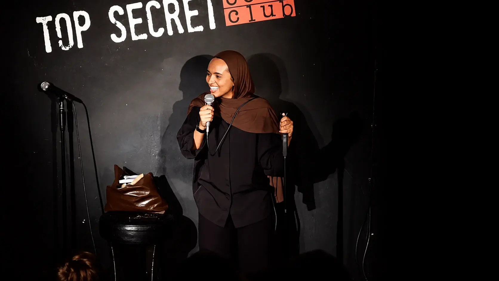 Fathiya Saleh performing at Top Secret Comedy Club
